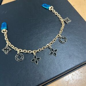 Gold and black purse charm